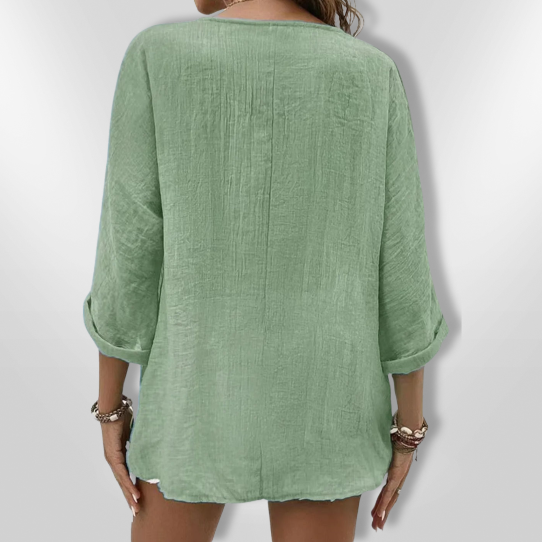 Dametopp med knapper og V-hals i lett stoff 6